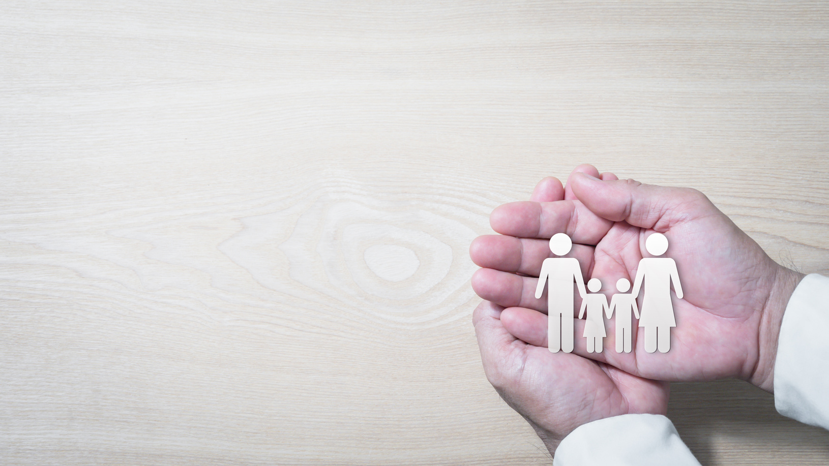 Person's Hands Holding Paper Family Cutout
